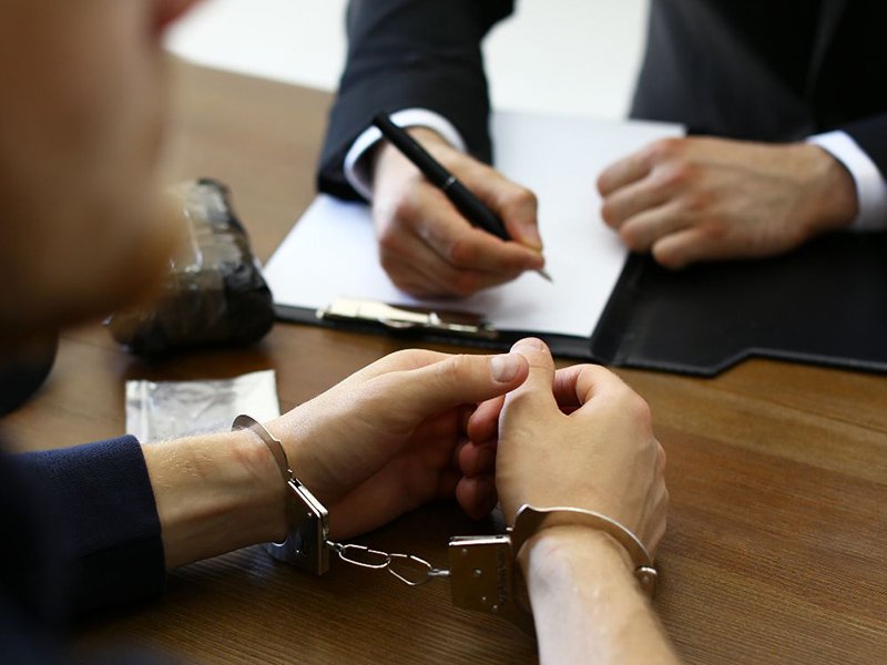 an arrested client and a lawyer